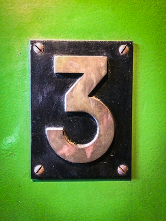 number 3 sign, number three metal sign on green background