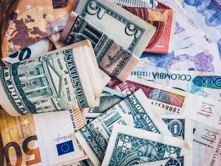 Cash money, Euros, US Dollars and Colombian Pesos