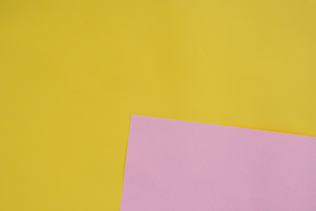 paper background, cardboard texture, yellow pink papersの写真素材