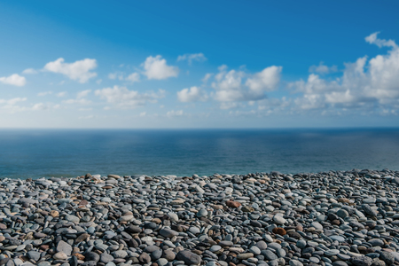 pebble stone beach - stones at ocean coastの写真素材