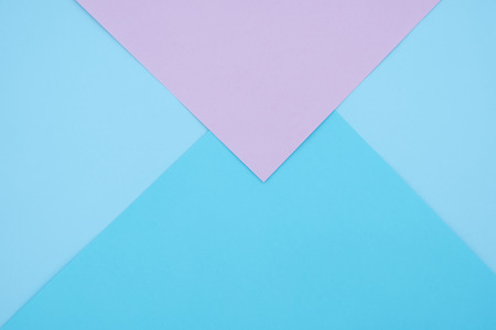 Blue and pink pastel color paper geometric flat lay background -の写真素材