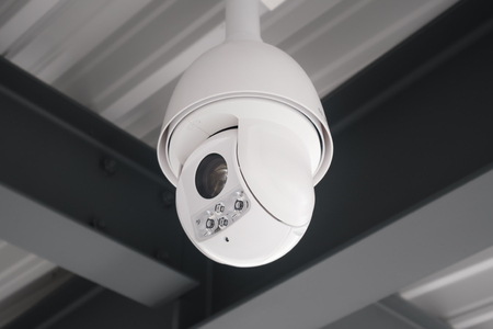 security camera hanging on ceiling - cctv camera