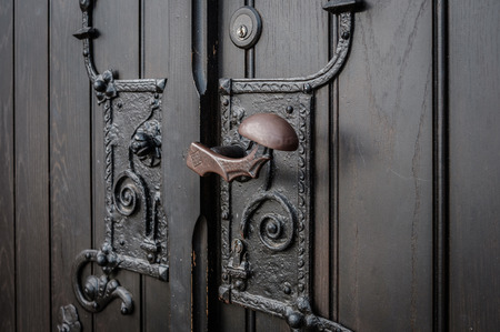 wrought metal door handle closeup -  church entrance -の写真素材