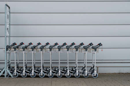 Row of luggage carts / baggage cars at airportの写真素材