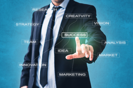 business concept - businessman pointing at success strategy componentsの写真素材