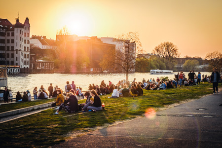 Berlin, Germany - april, 2019:  People enjoying sunset at river next to the Berlin Wall / East Side Gallery  in Berlin, Germanyのeditorial素材
