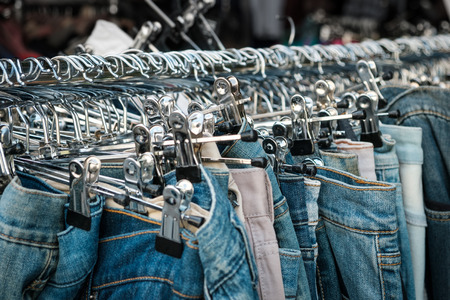 jeans  on hangers, second hand  store, trousers closeup  -の写真素材