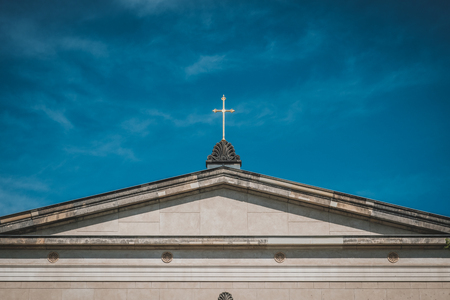golden cross on church roof - christian churchの写真素材