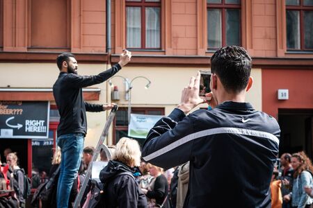 People take picture with mobile phone on street parade on laboratory day in Berlinのeditorial素材