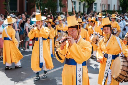 Korean people in traditional costumes performing at Carnival of Cultures in Berlinのeditorial素材