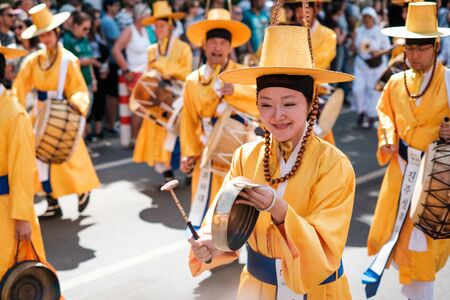 Korean people in traditional costumes performing at Carnival of Cultures in Berlinのeditorial素材