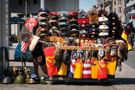 Souvenir vendor selling Cold War objects from East Germany (GDR) on street in Berlinのeditorial素材