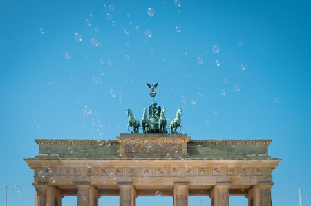 Brandenburg Gate / Brandenburger Tor on sunny day with blue sky and soap bubbles -の写真素材