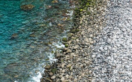 stone beach, pebble stones on ocean coast - nature backgroundの写真素材