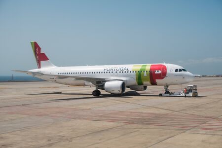 Airplane of the Airline Company TAP Air Portugal on airport runway