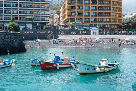 Fisher boats and people at city beach, former fishing harbor, Puerto de la Cruz, Tenerife