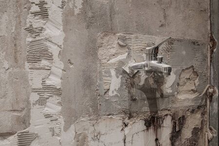 old water tap during bathroom renovation, plumber backgound -の写真素材