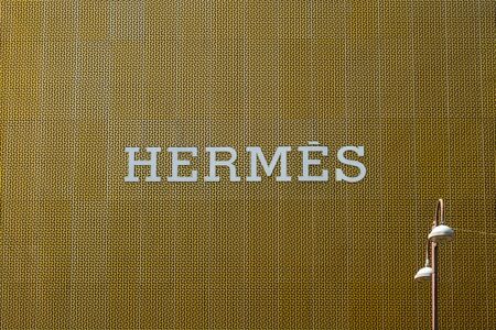 Hermes logo on Store exterior in Hong Kong. Herme's is a French manufacturer of lifestyle accessories and luxury goodsのeditorial素材