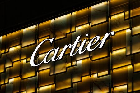 Hongkong - Noveber, 2019: Logo, signage, emblem of the brand Cartier on shop facade in HongKongのeditorial素材