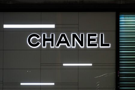 HongKong - November,  2019: The Chanel brand logo signage on Store facade in Hongkong at night
