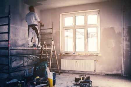 flat renovation concept, blur image of a person in apartment room during renovation 