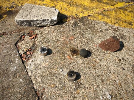 Rubber bullet and tear gas canister closeup on steet -の写真素材