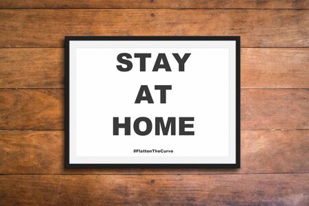 Stay at home flatten the curve sign - Coronavirusの写真素材