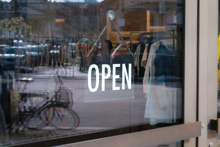 we are open sign on shop door - store window with open sign -の写真素材