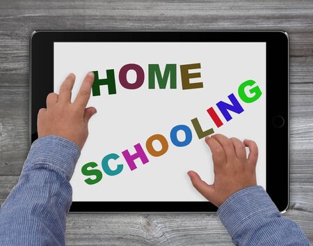 homeschool child with tablet computer - homeschooling conceptの写真素材