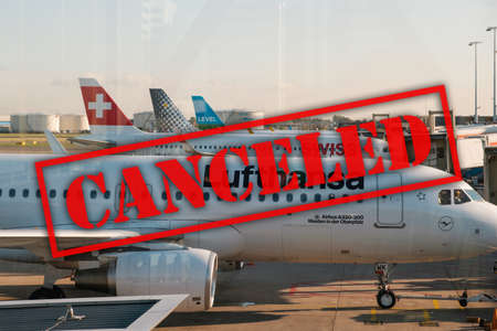 Amsterdam, Netherland - December, 2019: Lufthansa airplane and other airlines on airport in Amsterdam with canceled textのeditorial素材