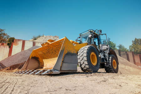 Excavator or bulldozer on construction site -