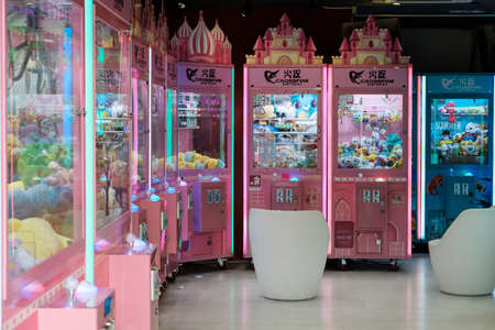 Hong Kong - November, 2019: Slot machine or automat with crane to grab and win toysのeditorial素材