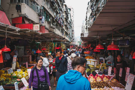 HongKong, China - November, 2019: People buying vegetables and fruits on street food market in HongKongのeditorial素材