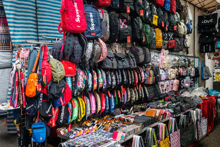 HongKong, China - November, 2019: Fashion, bags, clothing and merchandise on street market (Ladie's...