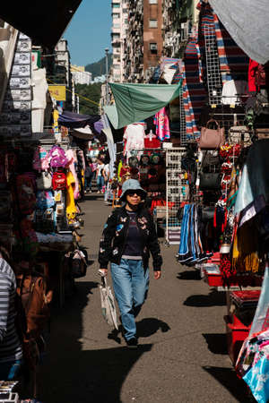 HongKong, China - November, 2019: Asian woman on street market (Ladie's Market) in Hong Kong, Tung Choi Streetのeditorial素材