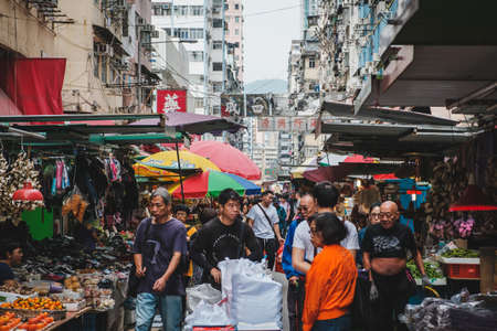 HongKong, China - November, 2019: People on crowded street food market in Hong Kongのeditorial素材