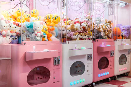 Hong Kong - November, 2019: Slot machine with crane to grab and win soft toysのeditorial素材