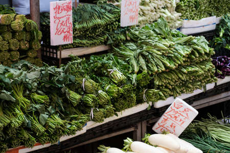 HongKong, China - November, 2019: Salad, spices and vegetables on street food market stand in Hong Kongのeditorial素材