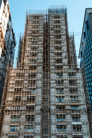 Bamboo scaffolding on building facade, bamboo pole framework,の写真素材