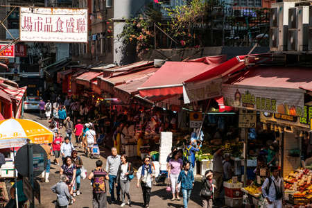 Hong Kong, November, 2019: Cityscape with people  on street market buying and selling food in Sham Shui Po, Hong Kong, Chinaのeditorial素材