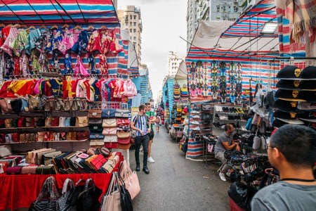 HongKong, China - November, 2019: Fashion, clothing and merchandise on street market (Ladie`s Market) in Hong Kong , Tung Choi Streetのeditorial素材
