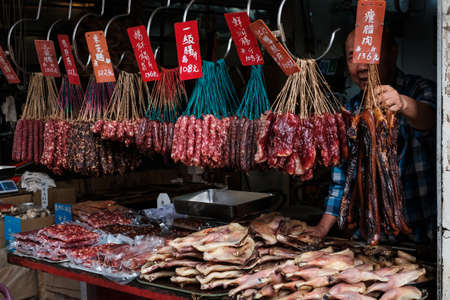 HongKong, China - November, 2019: Butcher selling meat on street market store in Hong Kongのeditorial素材