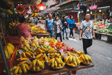Hong Kong - November, 2019: People buying groceries on crowded street food market in Hong kongのeditorial素材