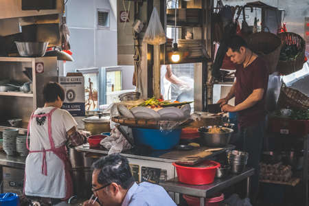 Hong Kong - November, 2019: Outdoor kitchen in street food restaurant in Soho, Hong Kongのeditorial素材