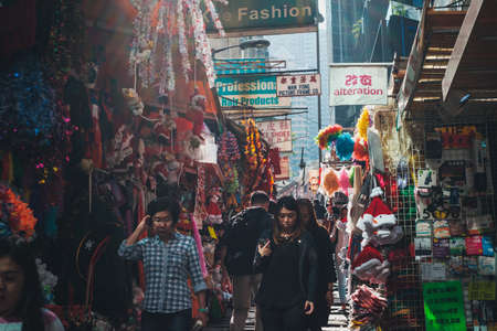 HongKong, China - November, 2019: People walking on street market in Soho, HongKong,