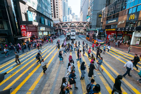 HongKong, November, 2019: Street traffic scene, pedestrian people crossing road in Hong Kong city,...