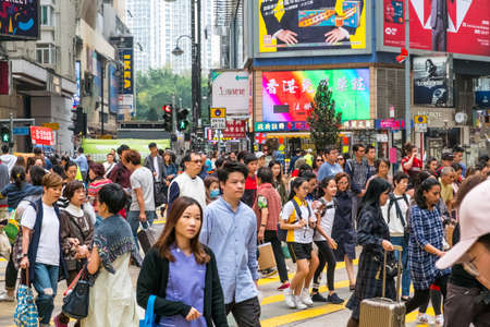 HongKong, November, 2019: Street scene, pedestrians crossing street in crowded shopping district (Causeway Bay) in Hong Kong cityのeditorial素材