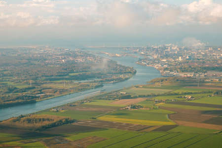 rural landscape aerial view with fields, river and village