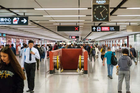 HongKong, China - November, 2019: People walking inside Central MTR station / underground subway train station in HongKongのeditorial素材