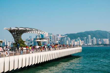 HongKong, China - November, 2019: People at Tsim Sha Tsui Promenade (Avenue of the Stars) at Victoria Harbor in Hong Kongのeditorial素材